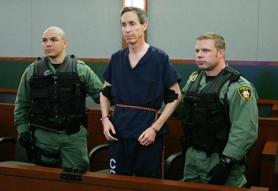 LAS VEGAS - AUGUST 31:  Warren Jeffs (C) is held by two Las Vegas Metropolitan Police Department SWAT officers during his extradition hearing in Las Vegas Justice Court at the Regional Justice Center August 31, 2006 in Las Vegas, Nevada. Jeffs, the fugitive leader of a polygamist Mormon sect who has been on the FBI's Ten Most Wanted List since May, will not fight extradition to Utah. He was arrested by a Nevada Highway Patrol trooper on August 28 during a traffic stop. Jeffs was wanted in Utah and Arizona on charges linked to allegations of arranging marriages between men and underage girls.  (Photo by Ethan Miller/Getty Images)