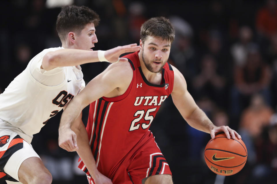 Utah guard Rollie Worster (25) brings the ball up as Oregon State guard Nick Krass (2) defends during the second half of an NCAA college basketball game in Corvallis, Ore., Thursday, Jan. 26, 2023. Utah won 63-44. (AP Photo/Amanda Loman)