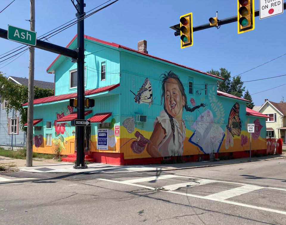 This property at 560 E. 12th St. was formerly a pub and the base for a food truck. Its outside was painted in 2022 as part of a public art mural project.