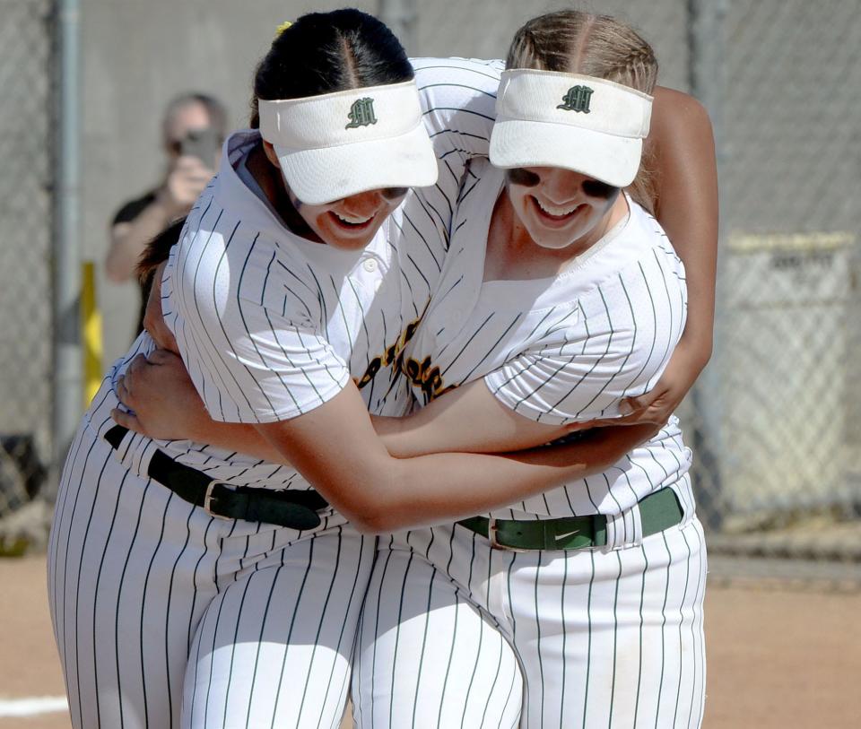 Driana Martinez, left, hugs teammate Kate Guy after Moorpark defeated Northridge-Heritage Christian 5-0 in a CIF-SS Division 4 semifinal game at Moorpark High on Tuesday, May 17, 2022.