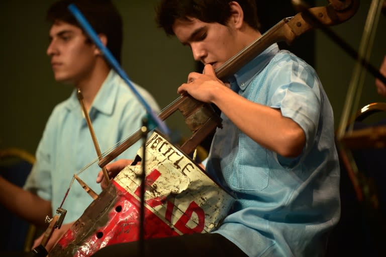 The Recycled Orchestra of Cateura from Paraguay plays during the Awards Ceremony 'Latinoamerica Verde', at the Crystal Palace in Guayaquil, Ecuador, in September 2015