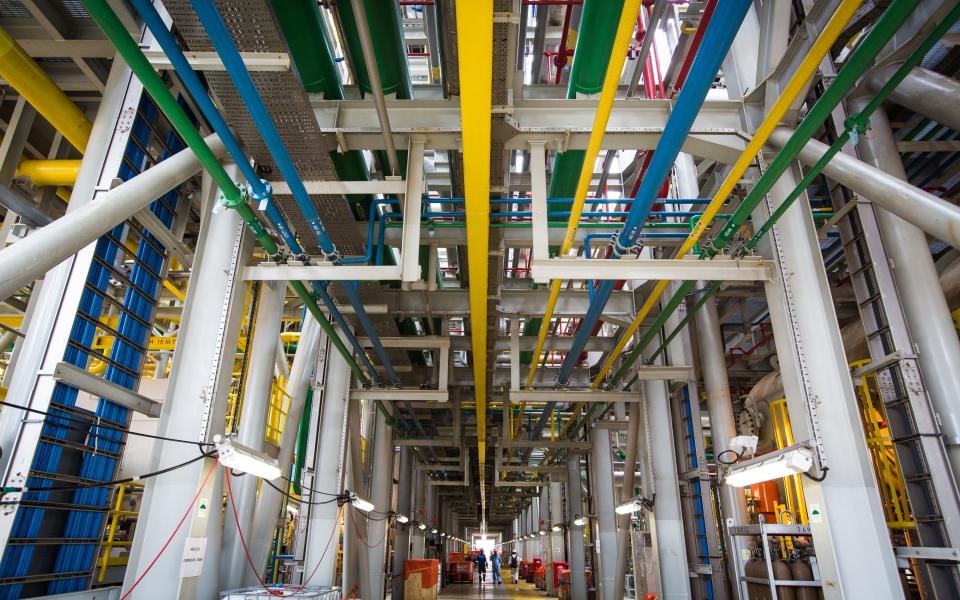 The floating storage and production and offloading vessel (above) will receive, process and store crude oil at Tullow's Ten Project oil development offshore Western Ghana. - Credit: Nicky Loh/Bloomberg