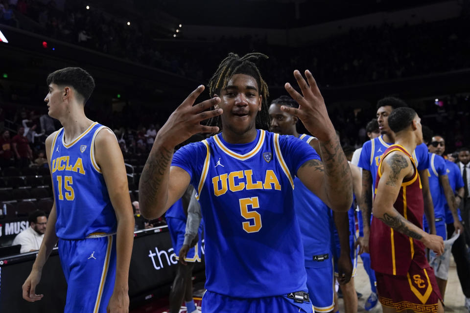 UCLA guard Brandon Williams, center, reacts after the team's win against Southern California during an NCAA college basketball game, Saturday, Jan. 27, 2024, in Los Angeles. (AP Photo/Ryan Sun)