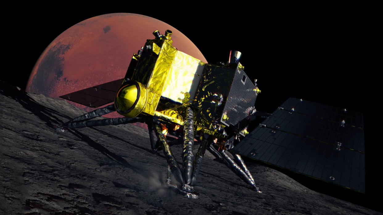  A gold-foil-covered spacecraft on the surface of a rocky moon. 