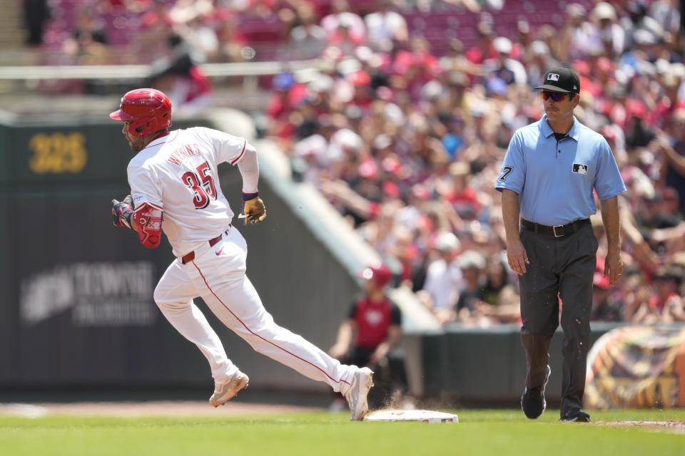 Cincinnati Reds' Austin Wynns (35) rounds the bases after hitting a double in the third inning of a baseball game against the Detroit Tigers in Cincinnati, Sunday, July 7, 2024. (AP Photo/Jeff Dean)