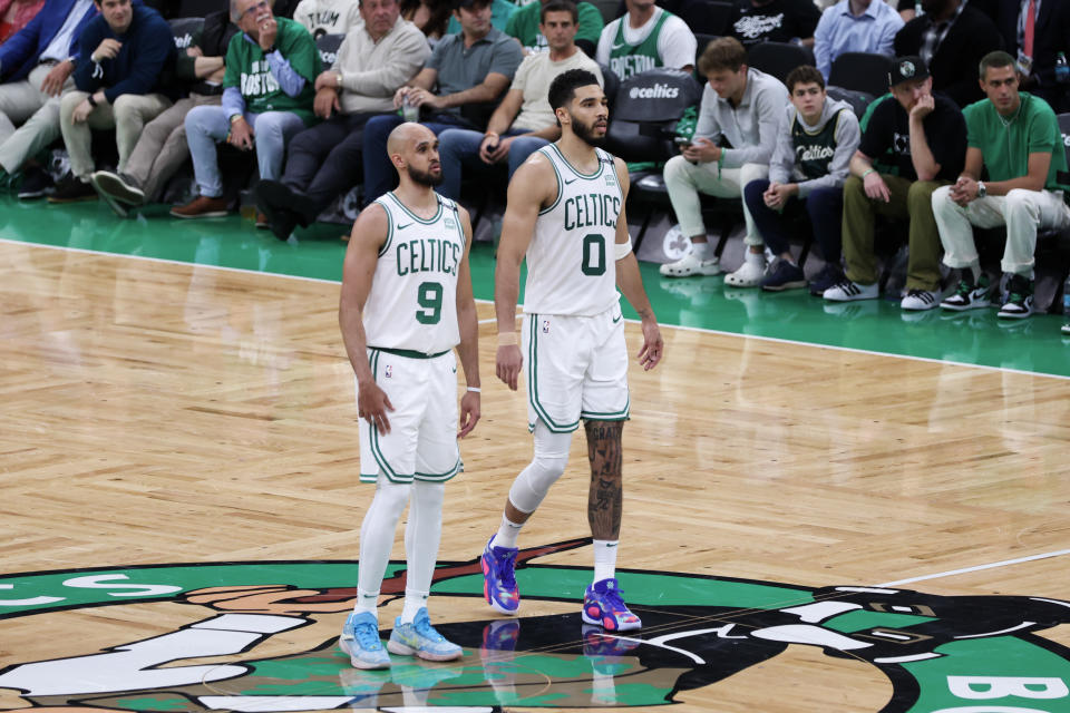 BOSTON, MASSACHUSETTS - JUNE 06: Derrick White #9 and Jayson Tatum #0 of the Boston Celtics look on during the first half against the Dallas Mavericks in Game One of the 2024 NBA Finals at TD Garden on June 06, 2024 in Boston, Massachusetts. NOTE TO USER: User expressly acknowledges and agrees that, by downloading and or using this photograph, User is consenting to the terms and conditions of the Getty Images License Agreement. (Photo by Adam Glanzman/Getty Images)