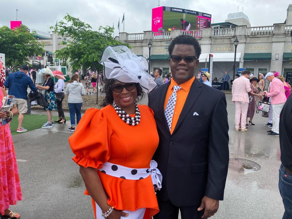 Geneva Barnes and Kermit Muhammad, a couple from Chicago, were in a radiant shade of tangerine orange amid a sea of pink on Kentucky Oaks Day on May 3, 2024.