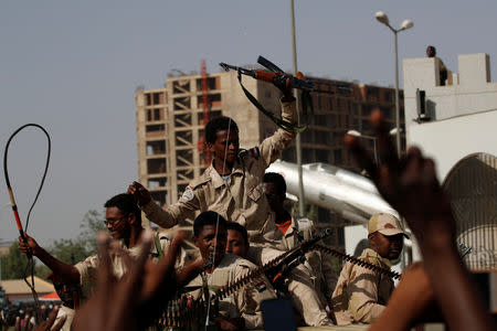 Sudanese soldiers are seen on their vehicles as they move with a military convoy outside the defense ministry compound in Khartoum, Sudan, April 25, 2019. REUTERS/Umit Bektas