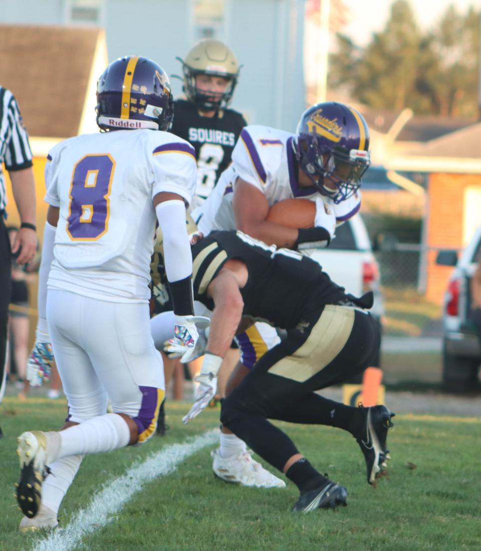Lancaster Catholic's Elijah Cunningham carries the ball down the field during a football game against Delone Catholic on Thursday, September 1, 2022, in McSherrystown. The Squires fell, 33-21.