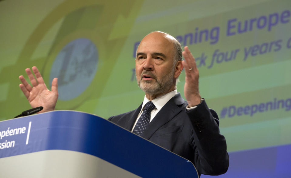 European Commissioner for Economic and Financial Affairs Pierre Moscovici speaks during a media conference at EU headquarters in Brussels, Wednesday, June 12, 2019. The European Commission on Wednesday took stock of the progress made to deepen Europe's Economic and Monetary Union and calls on Member States to take further concrete steps. (AP Photo/Virginia Mayo)