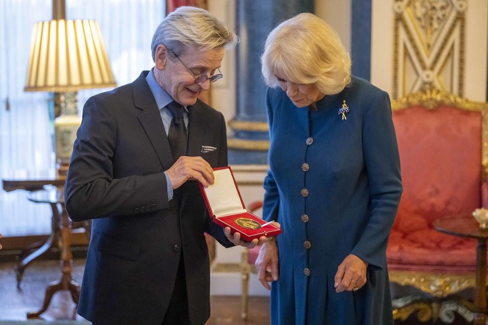 Britain's Camilla, the Queen Consort presents Mikhail Baryshnikov with the Royal Academy of Dance's highest honour, the Queen Elizabeth II Coronation Award, in recognition of his contribution to ballet and the wider world of dance, during a ceremony in the White Drawing Room at Buckingham Palace, London