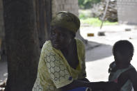 Josephine Noubarangal, a mother of six children, who suffered from violence is photographed outside her house in Binmar, Chad, Friday, July 19, 2024. (AP Photo/Robert Bociaga)