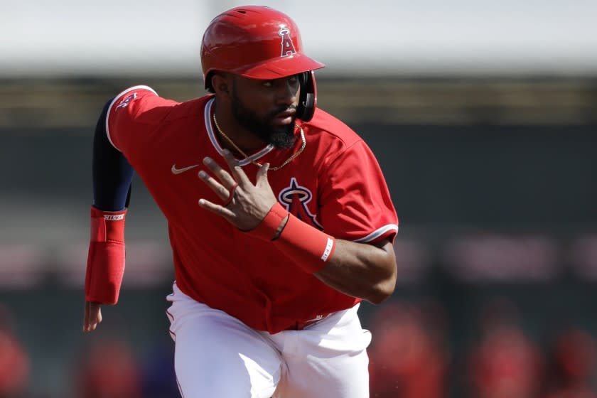 Los Angeles Angels' Jo Adell leads off from second base during the first inning of a spring training baseball game against the Colorado Rockies, Sunday, Feb. 23, 2020, in Tempe, Ariz. (AP Photo/Gregory Bull)