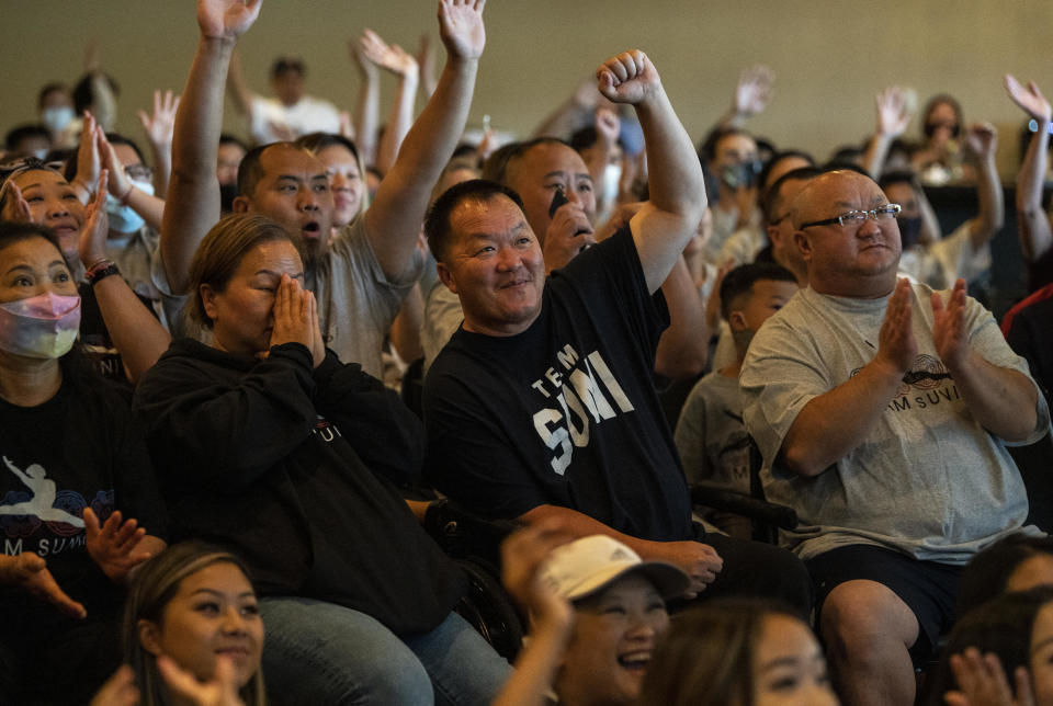 John Lee (C), father of Sunisa Lee of Team United States, reacts after her scores posted for the balance beam in the Women's All-Around Gymnastics Final on day six of the Tokyo 2020 Olympic Games at a watch party on July 29, 2021 in Oakdale, Minnesota. / Credit: Stephen Maturen / Getty Images