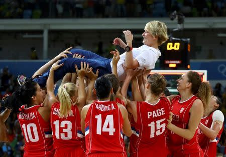 2016 Rio Olympics - Basketball - Final - Women's Bronze Medal Game France v Serbia - Carioca Arena 1 - Rio de Janeiro, Brazil - 20/8/2016. Head Coach Marina Maljkovic (SRB) of Serbia is lifted by her team as they celebrate. REUTERS/Jim Young
