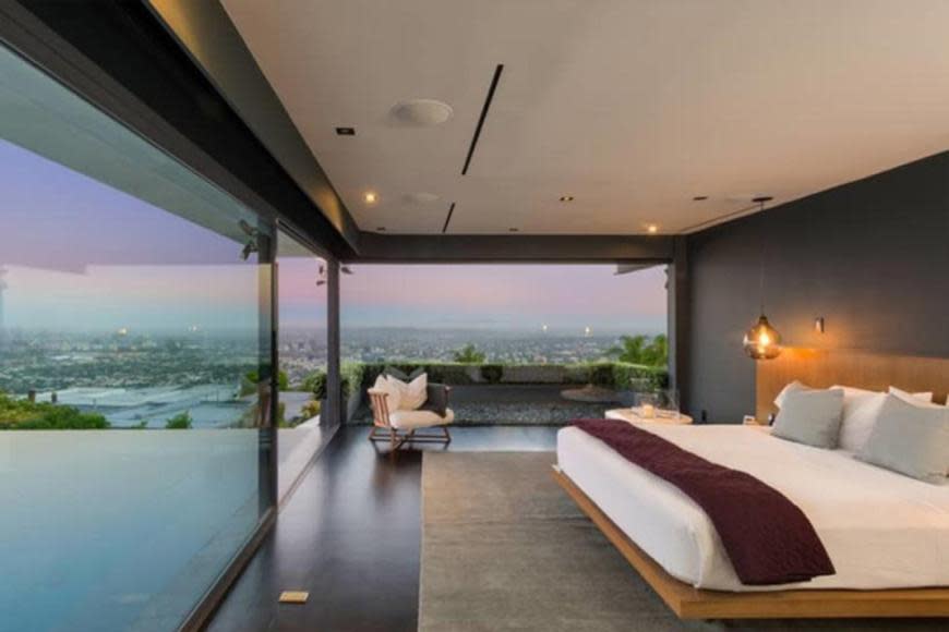 The mid-century mansion has floor-to-ceiling glass that gives a 180 degree view of Los Angeles.