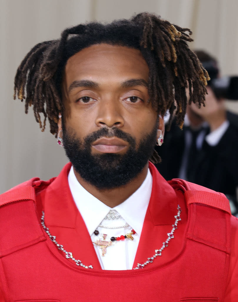 A close up of Kerby-Jean Raymond as he poses on the Met steps