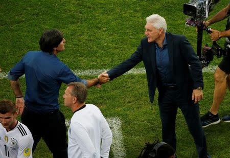 Soccer Football - Germany v Cameroon - FIFA Confederations Cup Russia 2017 - Group B - Fisht Stadium, Sochi, Russia - June 25, 2017 Germany coach Joachim Low and Cameroon coach Hugo Broos shake hands after the game REUTERS/Grigory Dukor