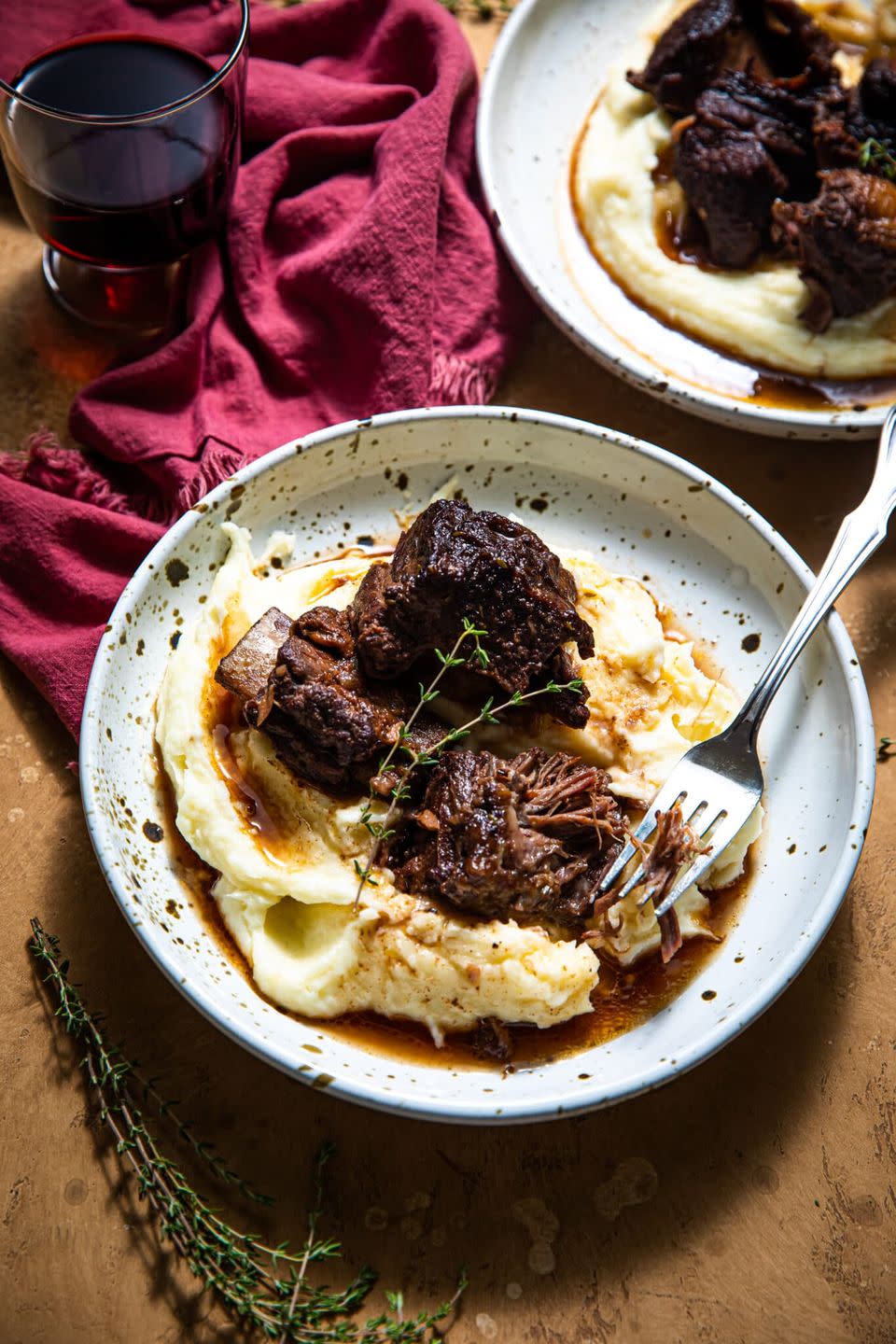 red wine braised short ribs over mash in bowl