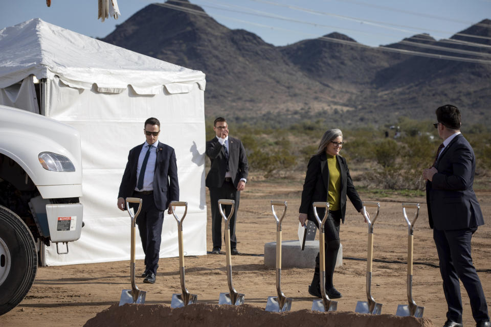 Arizona Gov. Katie Hobbs walks to the stage at the groundbreaking ceremony of the Ten West Link transmission line, Thursday, Jan. 19, 2023, in Tonopah, Ariz.(AP Photo/Alberto Mariani)