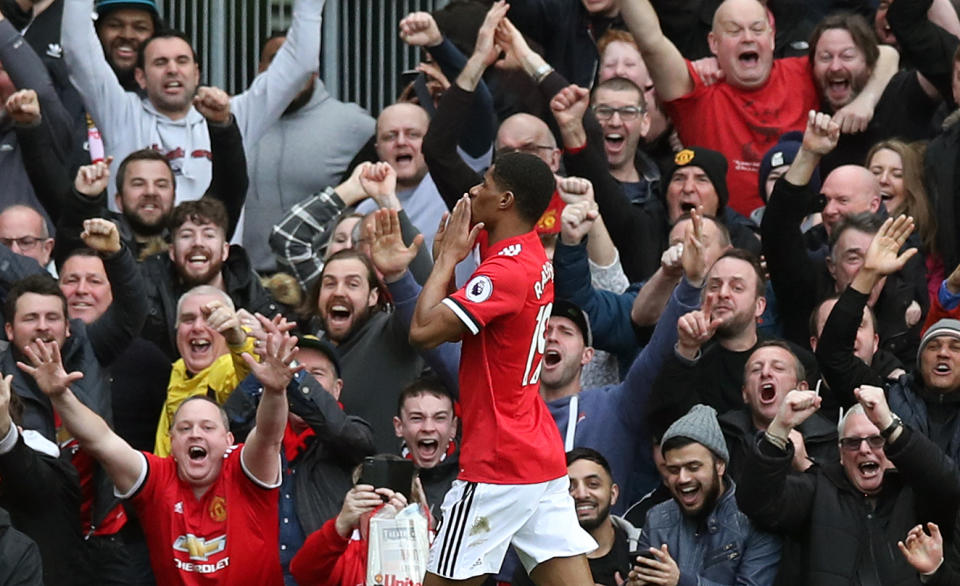 <p>Marcus Rashford celebrates his second goal </p>