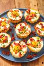 <p>Riced cauliflower replaces hash browns in these super savory breakfast cups. Filled with a runny baked egg and plenty of bacon, these are the perfect low-carb breakfast at the start of a busy day. <br><br>Get the <strong><a href="https://www.delish.com/cooking/recipe-ideas/a46832/cauliflower-hash-brown-egg-cups/" rel="nofollow noopener" target="_blank" data-ylk="slk:Cauliflower Hash Brown Egg Cups recipe;elm:context_link;itc:0;sec:content-canvas" class="link ">Cauliflower Hash Brown Egg Cups recipe</a></strong>. </p>