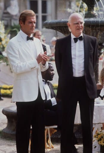 Actors Roger Moore (L) and Willoughby Gray stand together on the set of the 14th James Bond film "A View to a Kill" in Chantilly, France in 1984. Bond fans on Friday celebrated 50 years of the suave British spy's adventures on the silver screen with a day of 007-themed events around the world