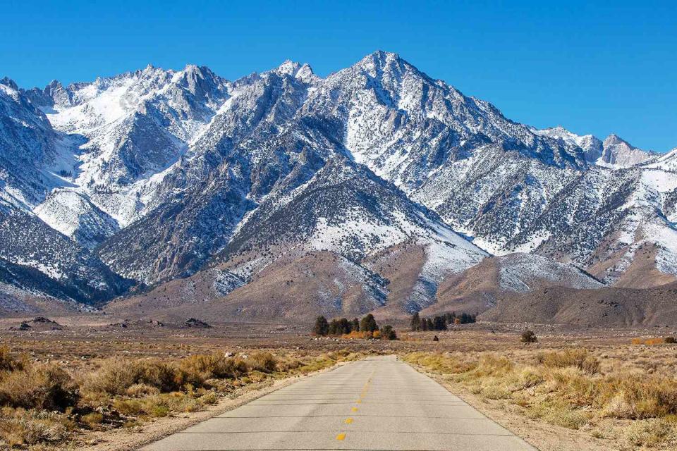 <p>George Rose/Getty</p> Snow-capped mountain range