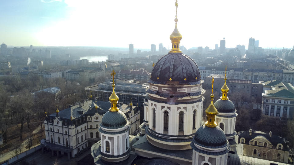 A hole from a shell explosion in the damaged dome of an Orthodox church is seen after what Russian officials in Donetsk said was a shelling by Ukrainian forces, in Donetsk, the capital of Russian-controlled Donetsk region, eastern Ukraine, Thursday, Dec. 15, 2022. (AP Photo)