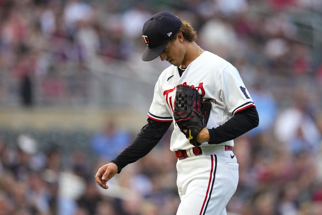 Minnesota Twins' Alex Kirilloff walks to the dugout after being