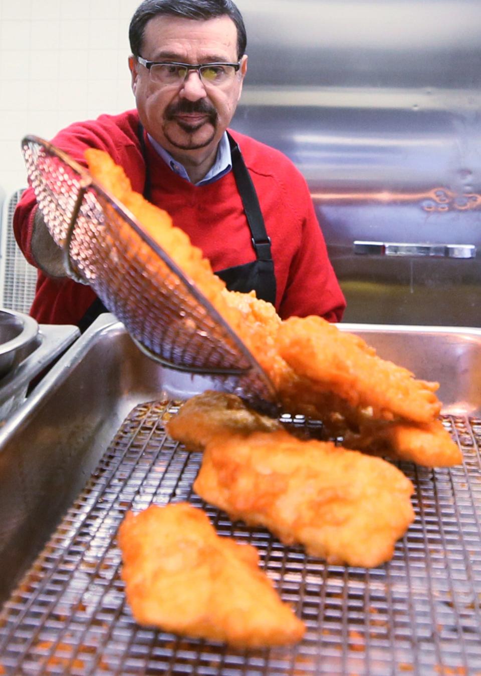 Ben Vittoria, "the original fish fryer" and owner of the last free-standing Arthur Treacher's Fish and Chips in the nation, serves up freshly fried fish at his restaurant on State Road in Cuyahoga Falls.