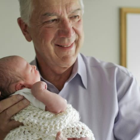 Grandfather holding baby