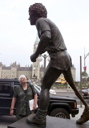 Betty Fox, in 2000, visits the statue of her son Terry that is situated below Parliament Hill in Ottawa.