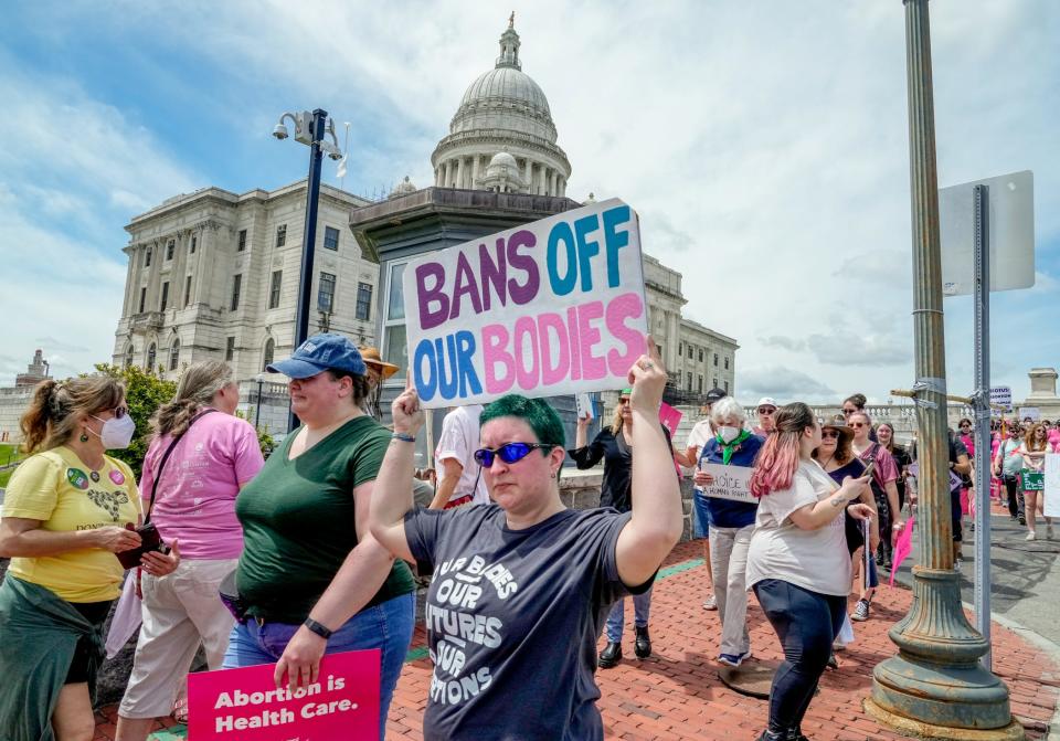 Hundreds of protesters march near the Rhode Island State House as part of Saturday's nationwide rally in support of the legal right to an abortion.