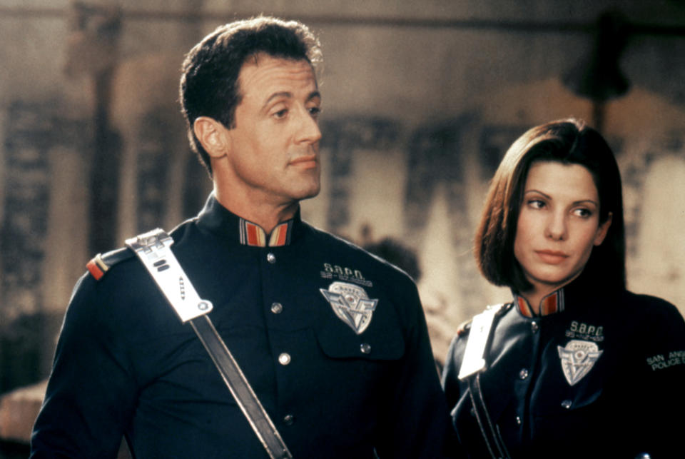 American actors Sylvester Stallone and Sandra Bullock on the set of <Demolition Man> directed by Marco Brambilla. (Photo by Sunset Boulevard/Corbis via Getty Images)