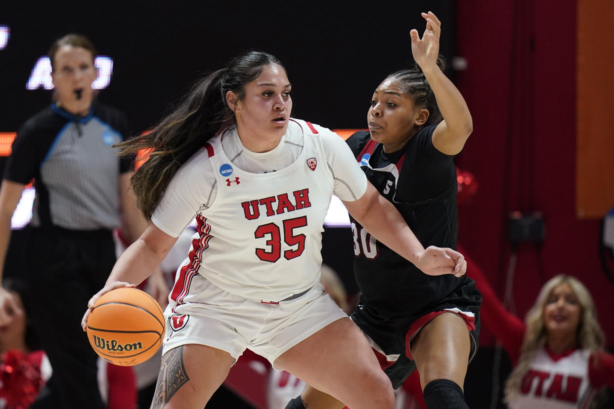 FILE - Gardner-Webb forward Alasia Smith (30) guards Utah forward Alissa Pili (35) during the second half of a first-round college basketball game in the women's NCAA Tournament, March 17, 2023, in Salt Lake City. The biggest recruiting coup came when Pili joined the Utes after transferring from Southern California. Pili immediately elevated Utah to a conference title contender. She averaged 20.7 points on 59% shooting last season with 5.6 rebounds and 2.3 assists. (AP Photo/Rick Bowmer, File)