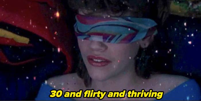 Character with blindfold and sparkly top, caption reads "Thirty and flirty and thriving."