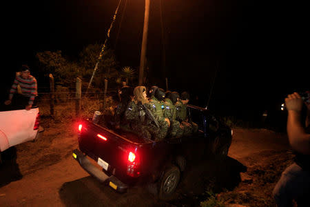 Honduras soldiers arrive to guard the area where Hilda Hernandez, the sister of Honduran President Juan Orlando Hernandez, and five others died when the helicopter they were travelling in crashed in San Matias, Honduras December 16, 2017. REUTERS/ Jorge Cabrera