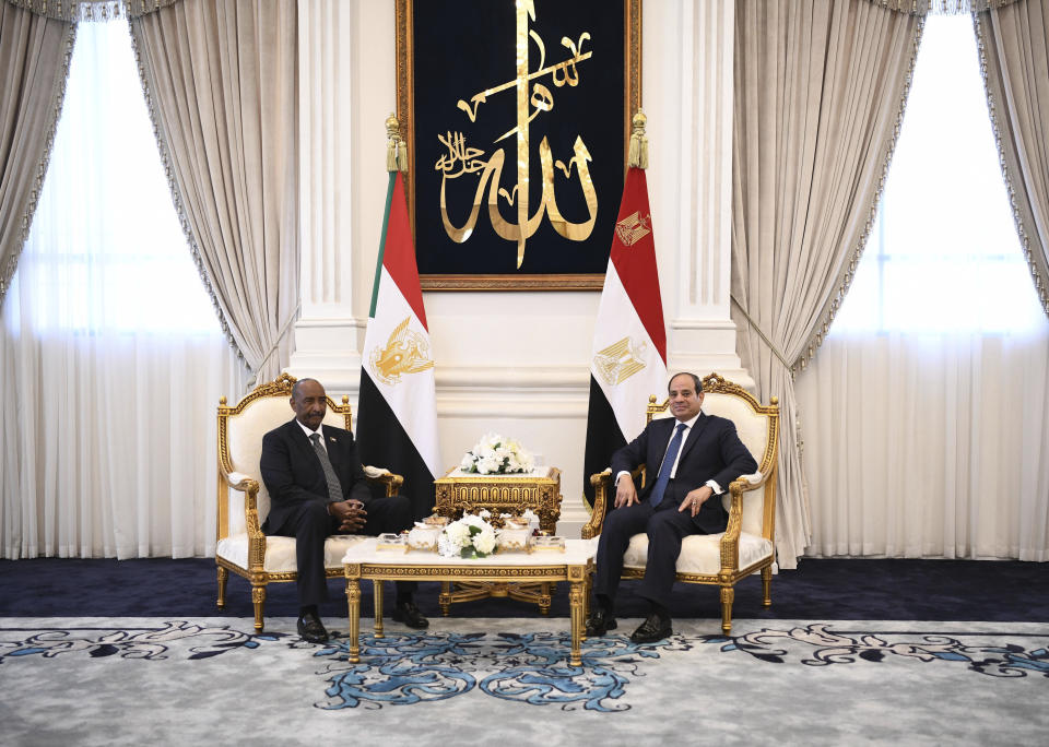 In this photo provided by Egypt's presidency media office, Egyptian President Abdel-Fattah el-Sissi, right, meets with Sudan's army chief General Abdel Fattah al-Burhan at the Presidential palace in el-Alamein city, Egypt, Tuesday, Aug. 29, 2023. (Egyptian Presidency Media Office via AP)