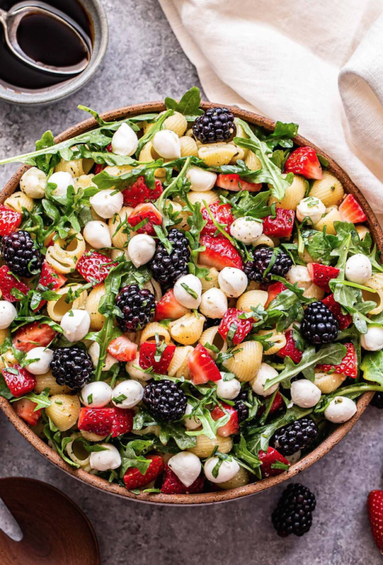 <p>Recipe Runner</p><p>Strawberries, blackberries, arugula and mini mozzarella balls and pasta are all tossed together with an easy pesto dressing. Simple, delicious and sure to be a hit!</p><p><strong>Get the recipe: <a href="https://reciperunner.com/berry-pesto-pasta-salad/" rel="nofollow noopener" target="_blank" data-ylk="slk:Berry Pesto Pasta Salad;elm:context_link;itc:0;sec:content-canvas" class="link rapid-noclick-resp"><em>Berry Pesto Pasta Salad</em></a></strong></p>