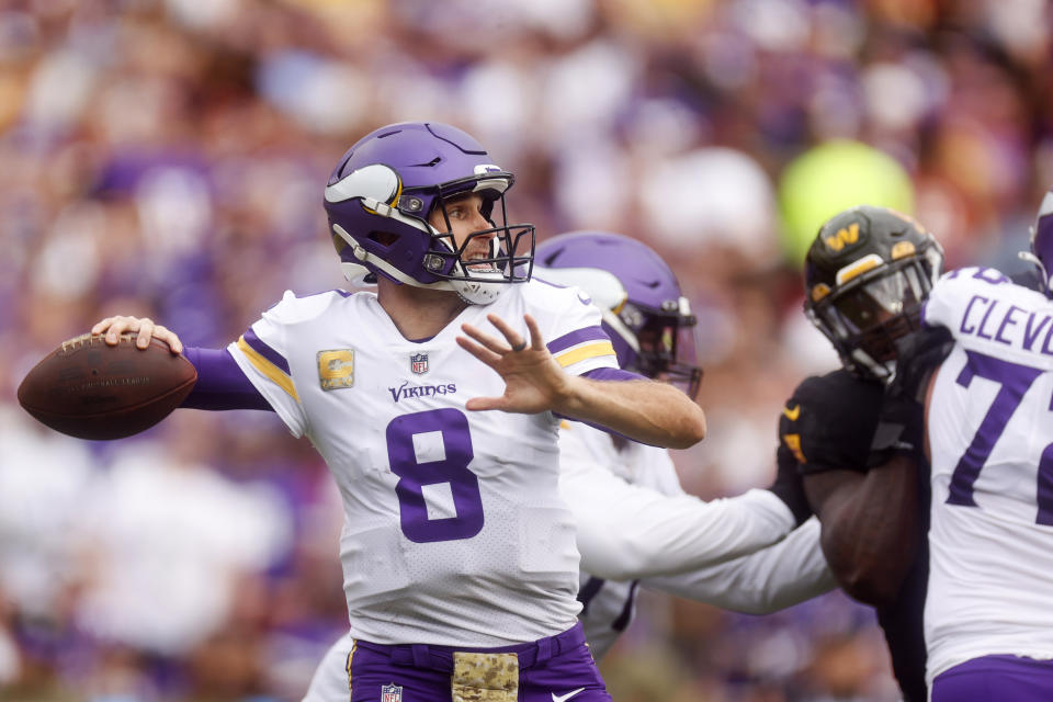 Minnesota Vikings quarterback Kirk Cousins (8) looks to make a pass during the first half of a NFL football game between the Washington Commanders and the Minnesota Vikings on Sunday, Nov. 6, 2022 in Landover, Md. (Shaban Athuman/Richmond Times-Dispatch via AP)
