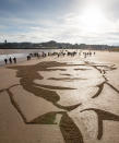 <p>Dr Elsie Ingilis, an innovative Scottish doctor, suffragist, and founder of the Scottish Women’s Hospitals, etched on to West Sands Beach, St Andrews, Scotland. (Getty) </p>