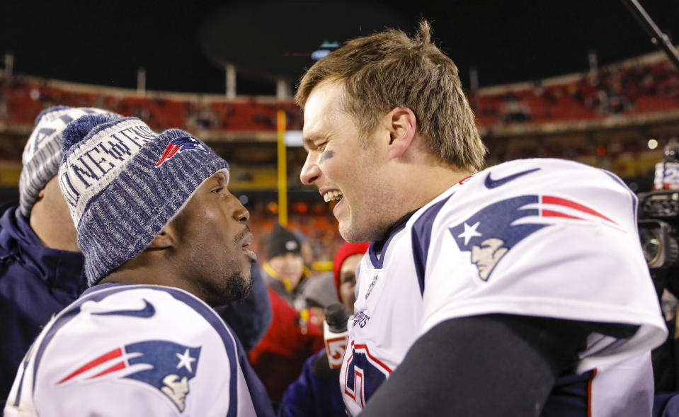 Quarterback Tom Brady and safety Devin McCourty celebrate an AFC championship game win over the Chiefs. (Photo by David Eulitt/Getty Images)