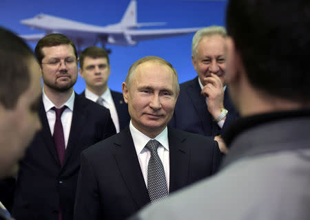 Russian President Vladimir Putin meets with employees during a visit to the Gorbunov Aviation factory in Kazan, Russia January 25, 2018. Sputnik/Alexei Nikolsky/Kremlin via REUTERS