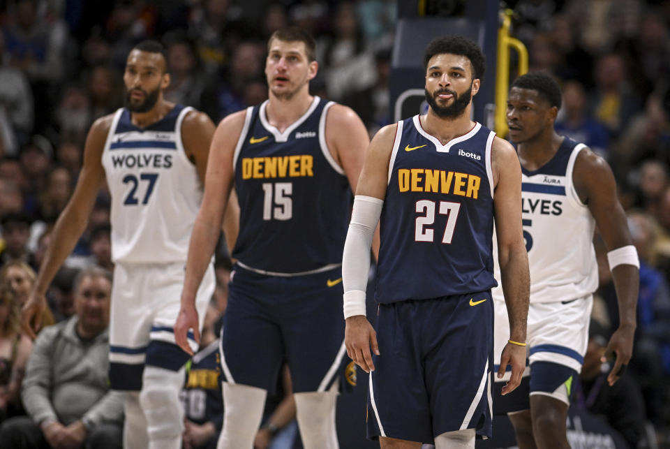 DENVER, CO - APRIL 10: Nikola Jokic (15) and Jamal Murray (27) of the Denver Nuggets size up with Rudy Gobert (27) and Anthony Edwards (5) of the Minnesota Timberwolves during the third quarter at Ball Arena in Denver on Wednesday, April 10, 2024. (Photo by AAron Ontiveroz/The Denver Post)