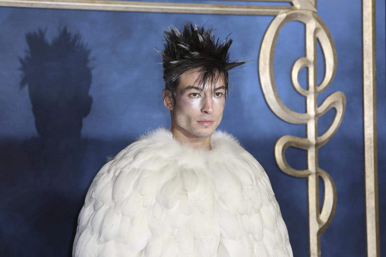 FILE - Actor Ezra Miller poses for photographers upon arrival at the premiere of the film "Fantastic Beasts: The Crimes of Grindelwald," at a central London cinema, Tuesday, Nov. 13, 2018. The actor known for playing "The Flash" in "Justice League" films was arrested at a Hawaii karaoke bar and is scheduled to be arraigned on Tuesday, April19, 2022, on charges of disorderly conduct, harassment and obstructing a highway. (Photo by Grant Pollard/Invision/AP,File)