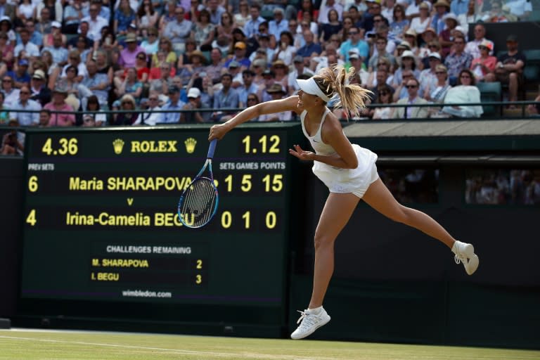 Russia's Maria Sharapova serves against Romania's Irina-Camilia Begu during their women's singles third round match on day five of the 2015 Wimbledon Championships at The All England Tennis Club in Wimbledon, southwest London, on July 3, 2015