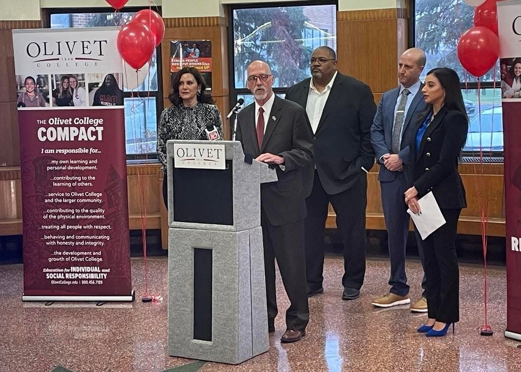 Olivet College President Steven Corey announces the Olivet College ADVANTAGE Scholarship on Thursday, Dec. 8, 2022, at J.W. Sexton High School in Lansing. He is flanked, from left, by Gov. Gretchen Whitmer, Sexton Principal Dan Boggan, Lansing School District Superintendent Benjamin Shuldiner and Emma Marie Asaf, a 2019 Sexton graduate and a senior at Olivet College.