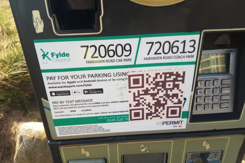 The scam QR codes placed on parking machines