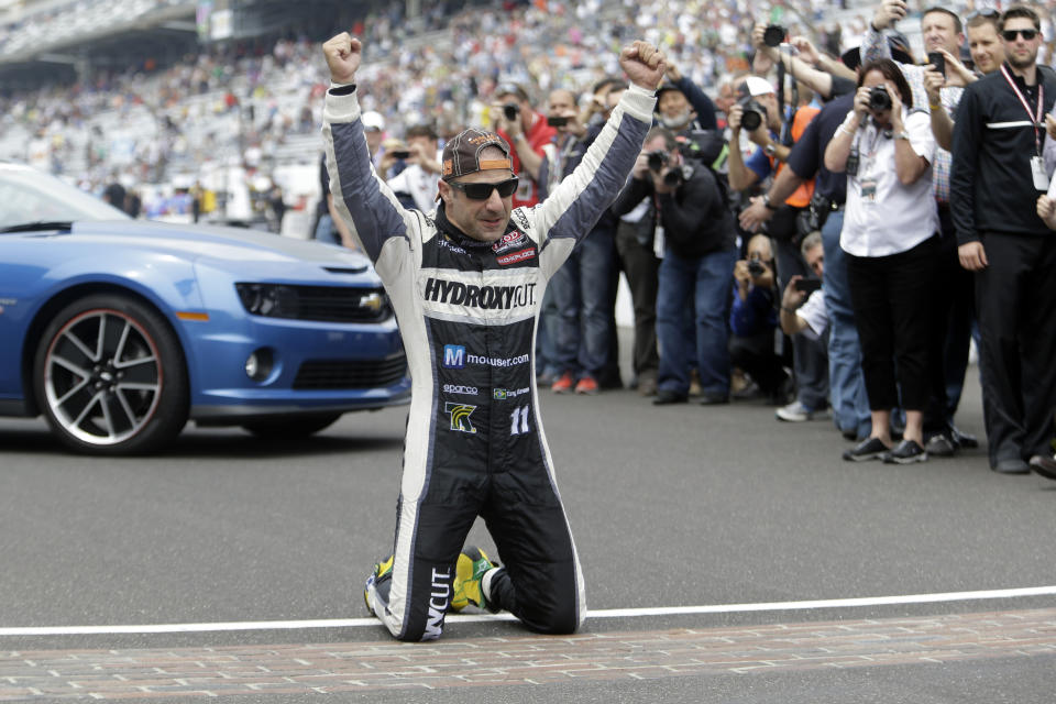 FILE - In this May 26, 2013, file photo, Tony Kanaan, of Brazil, celebrates on the start/finish line after winning the Indianapolis 500 auto race at the Indianapolis Motor Speedway in Indianapolis, Kanaan will get to race 5 oval events, including the Indianapolis 500, in what will be called his “farewell tour” this upcoming IndyCar season. (AP Photo/Tom Strattman, File)
